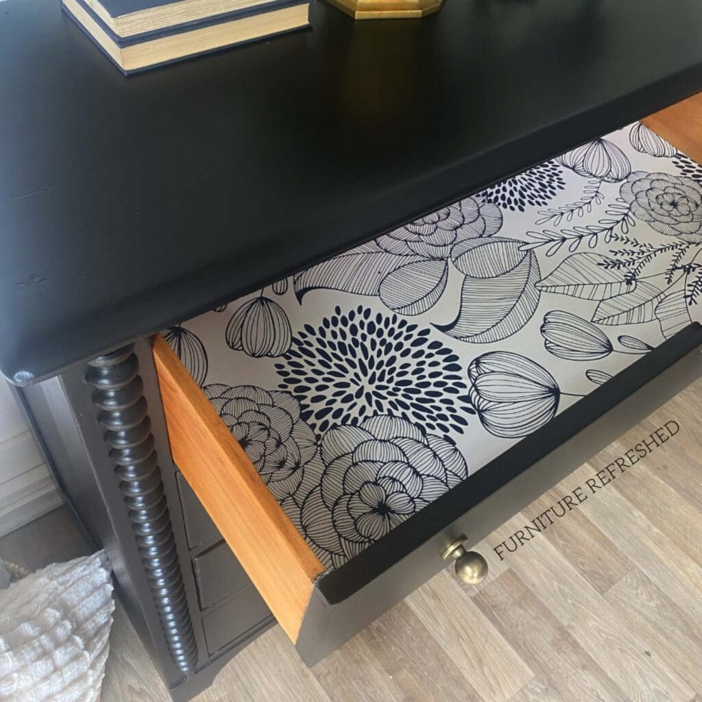 Close up of the inside of the drawer with a floral drawer liner.