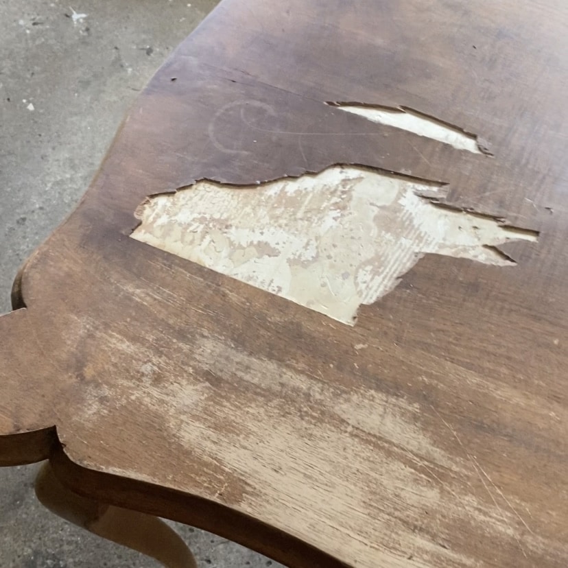 Veneer damage on the top of a desk