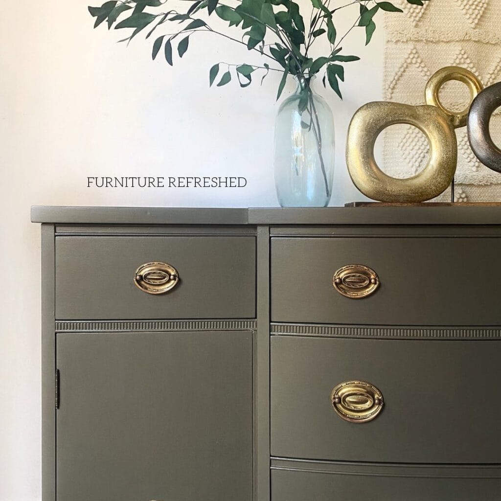 Stylish grey painted furniture with elegant gold hardware, perfect for home decor.