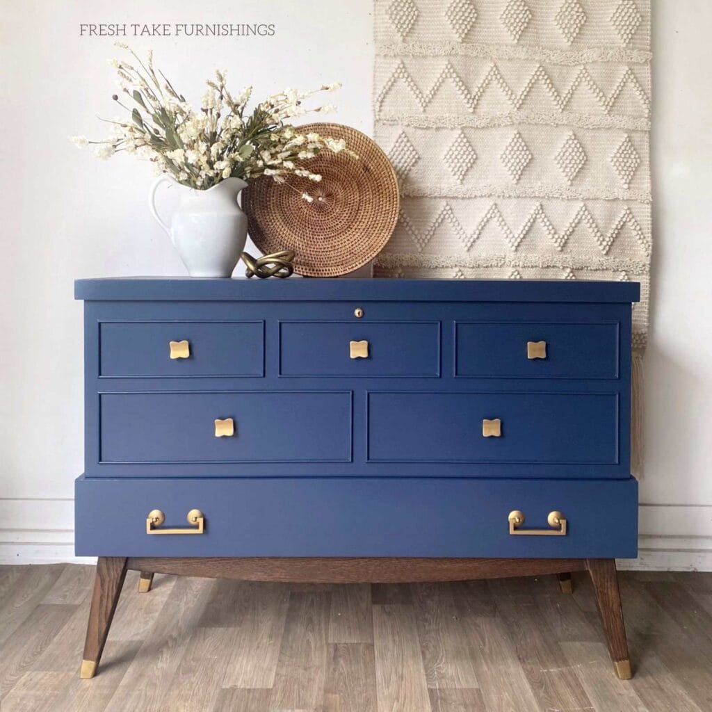 After front photo of painted cedar chest.