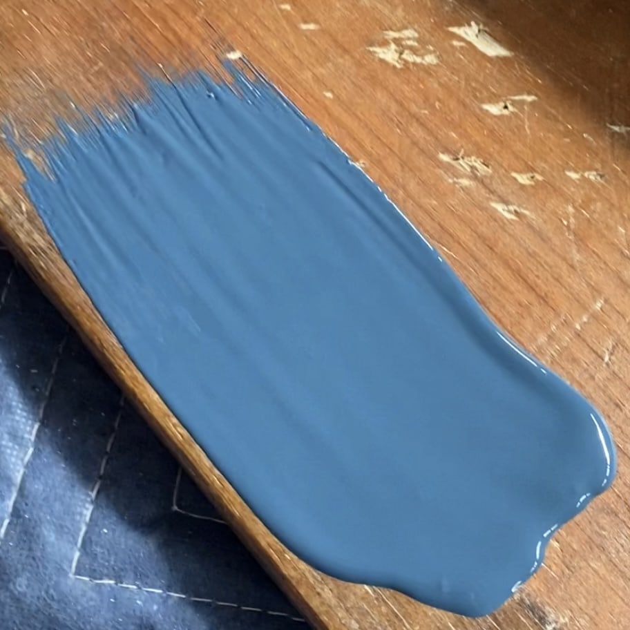 Choosing a paint color - swatching out a teal paint.