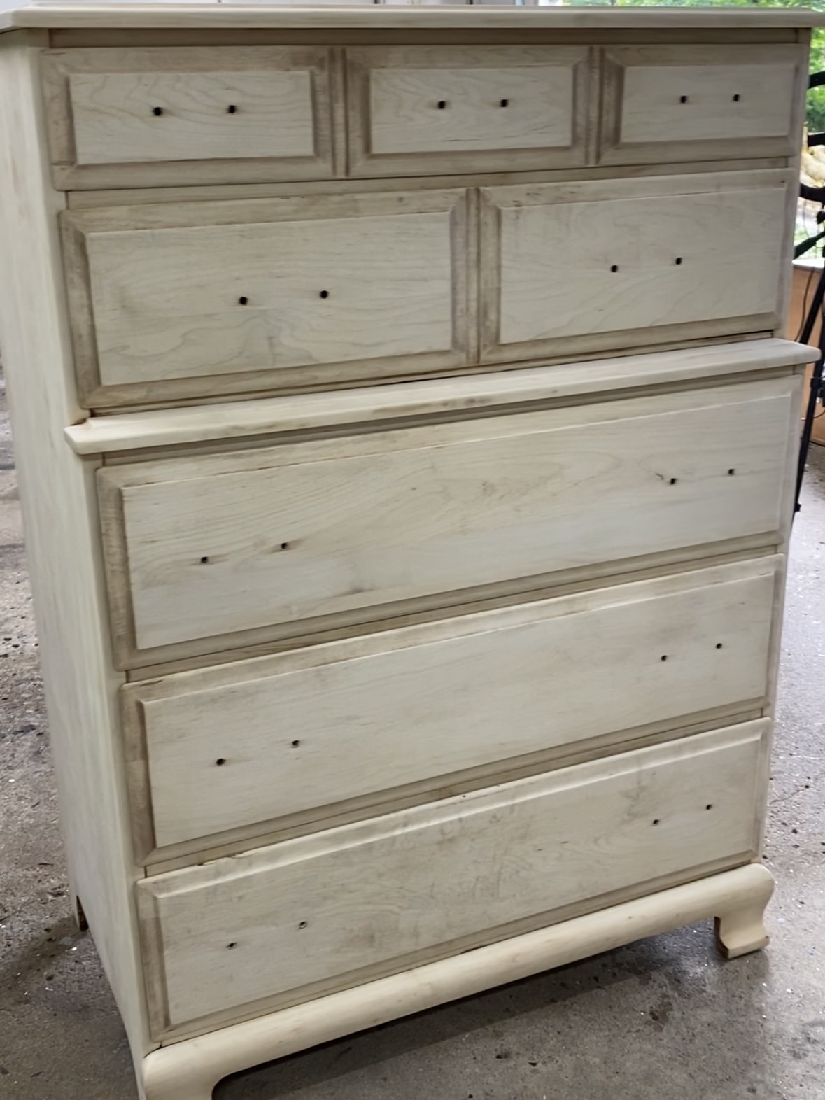 The maple dresser with all of old finish removed, before the paint was is applied.