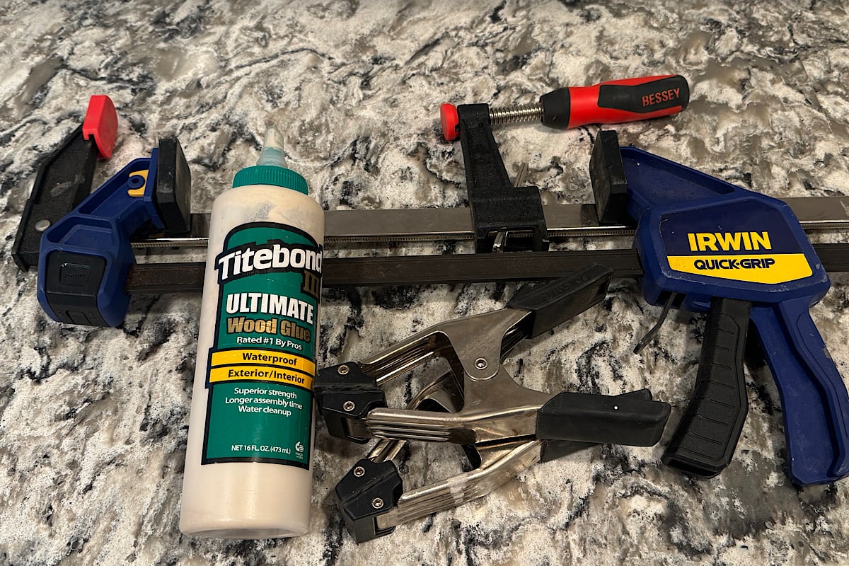 Wood glue and clamps used for furniture flipping.