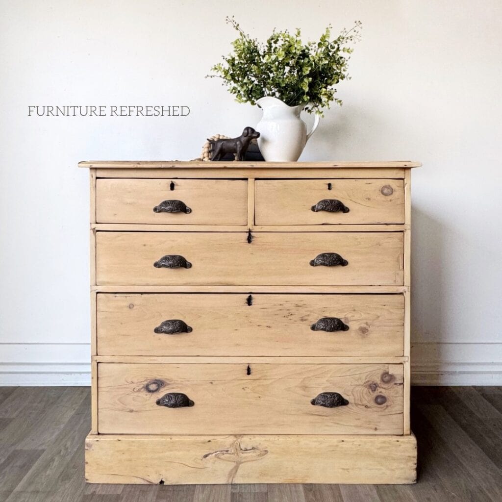 Pine dresser with a raw wood look and black cup pulls.