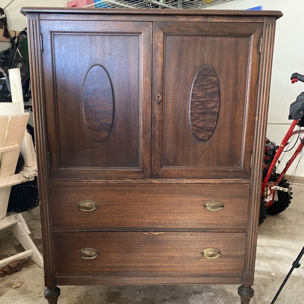 Before photo of wardrobe cabinet that is stained wood.