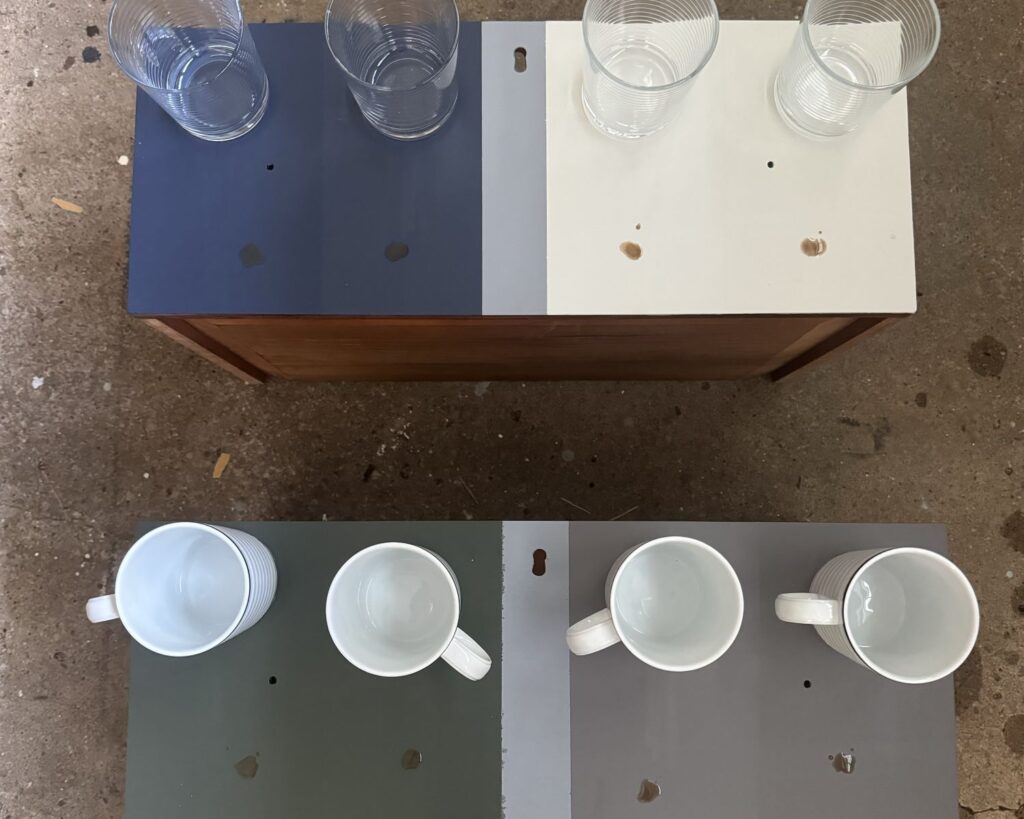 Painted surfaces tested for water stains and coffee stains with mugs and glasses.