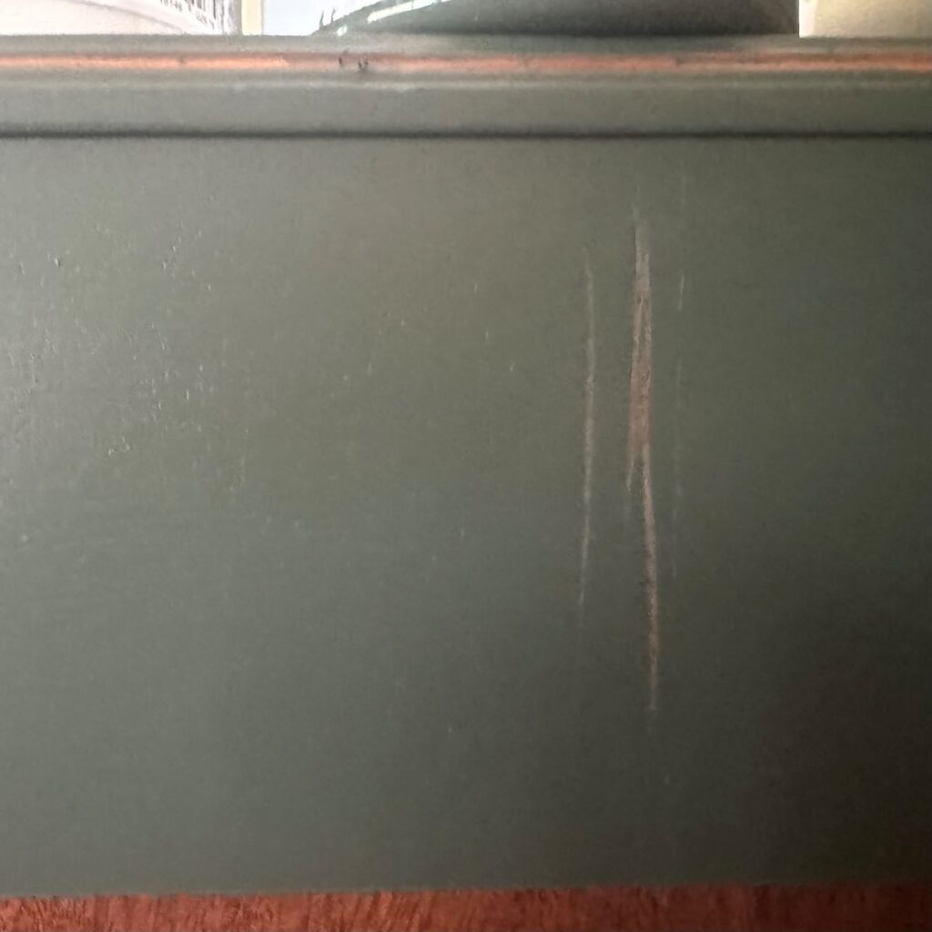 Melange ONE paint with no primer or topcoat scratched off with metal scraper.
