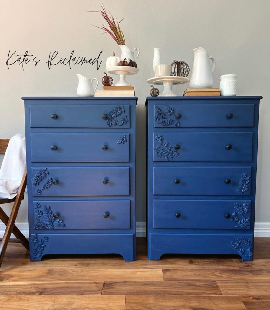 Set of painted blue nightstands will floral resign molds added.