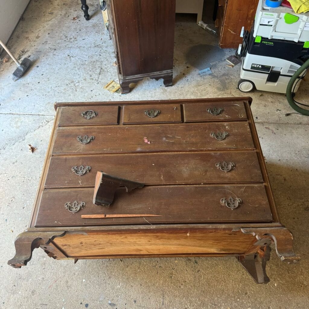 Before photo of dresser with a broken leg.