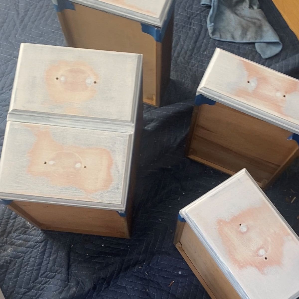 Drawers after one coat of stain blocking primer, pink bleed through is evident.