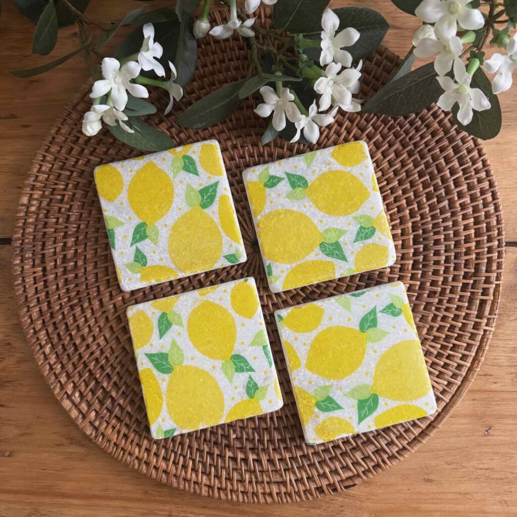 Marble coasters with a lemon pattern on them