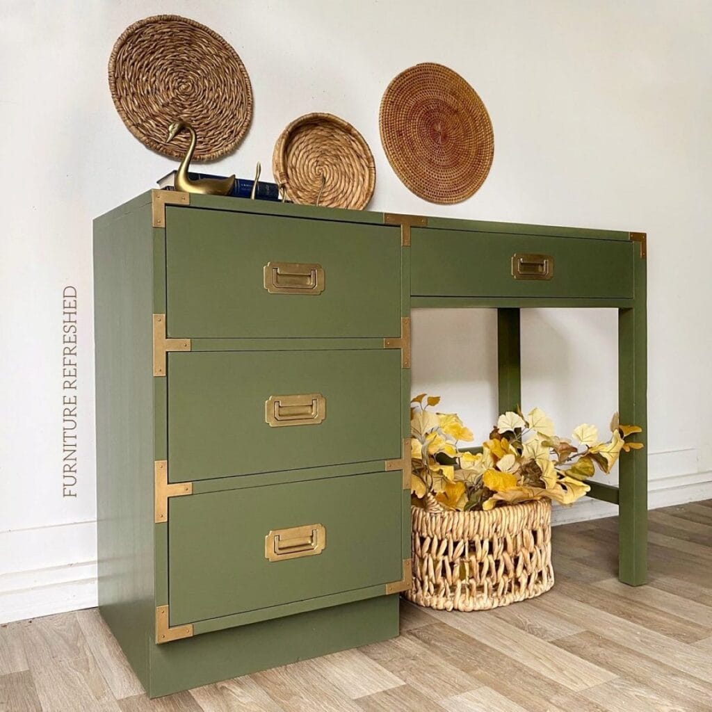Angled photo of Campaign style desk painted in green.