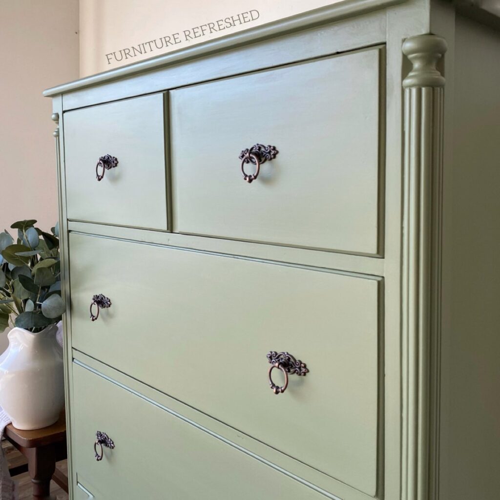 Close up side angle of painted sage dresser