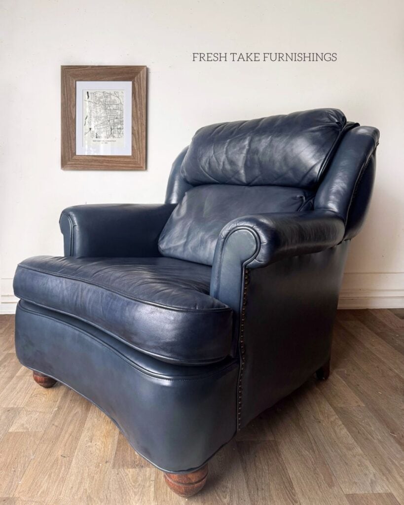 After photo of repaired blue leather chair.