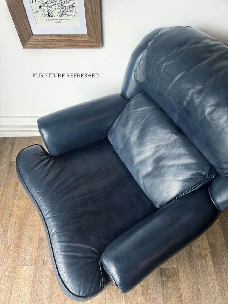 After photo of blue leather chair.