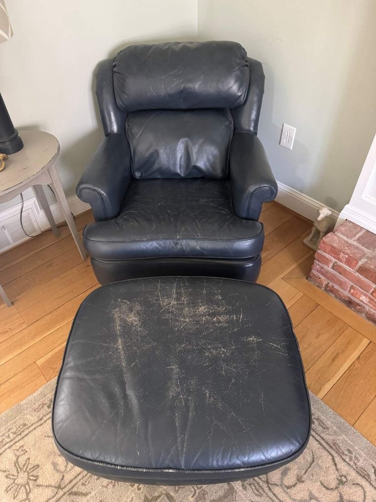 Before photo of blue leather chair and ottoman with scratches and fading in the leather.