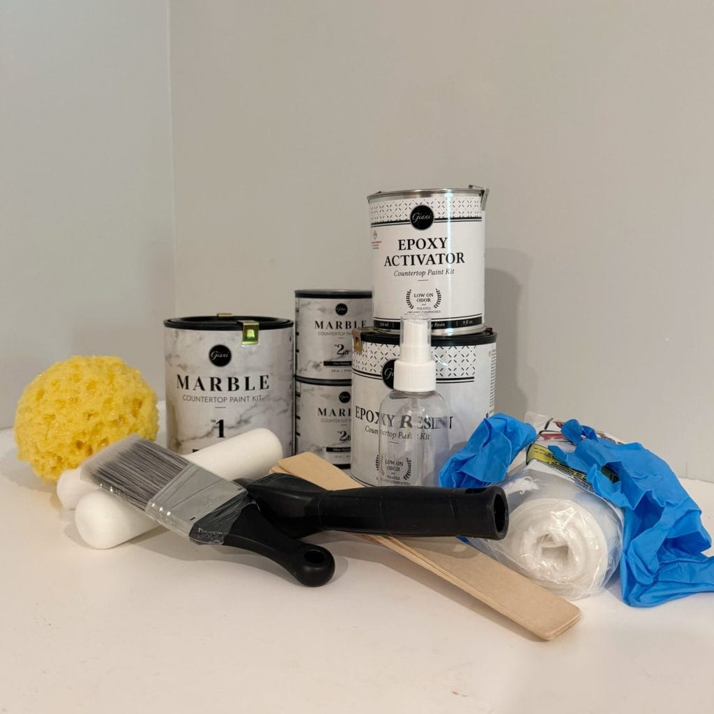 Photo of the contents of the Giani Granite DIY Faux Carrera Marble Countertop. Kit.