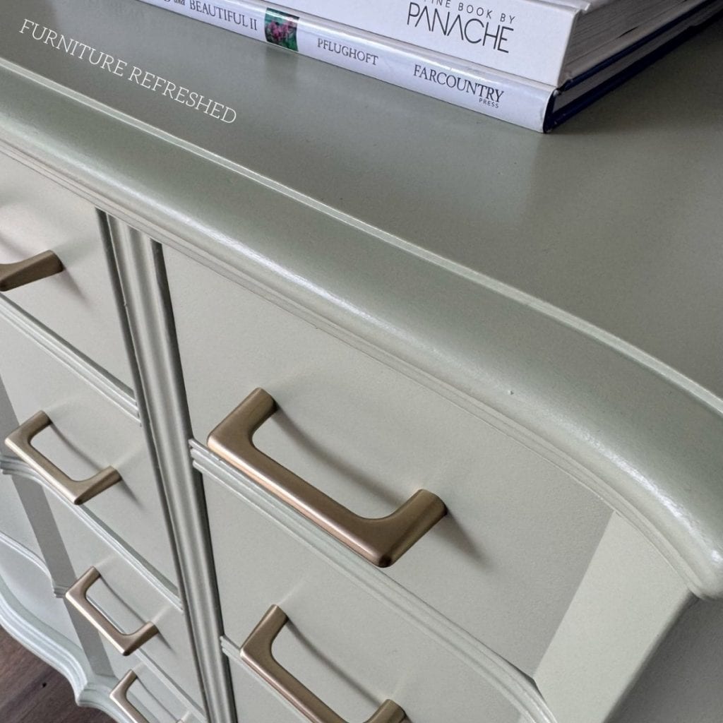 Closeup of the champagne bronze hardware added to this dresser.