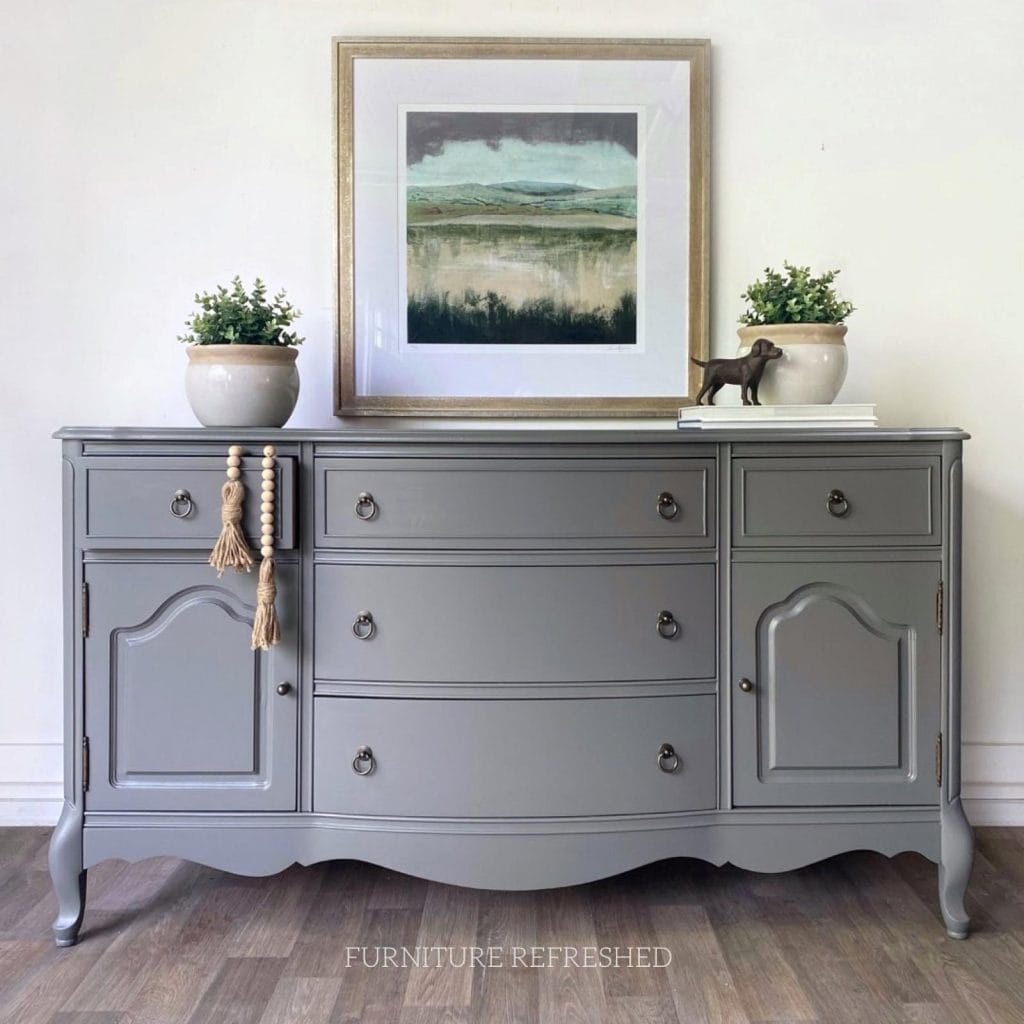 After photo of wood French Provencal buffet painted in light gray.