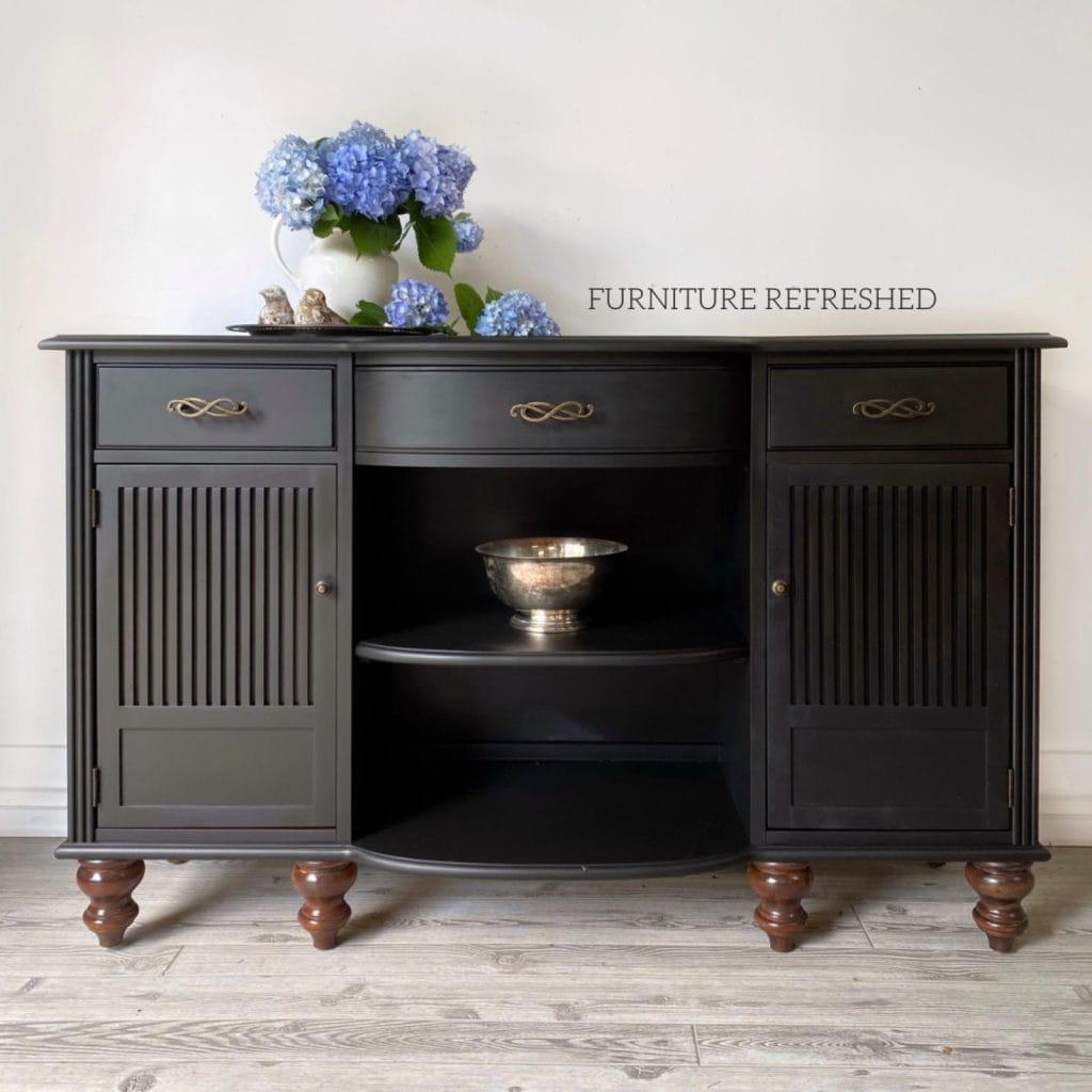 After photo of the same buffet painted black with new oil rubbed bronze hardware.