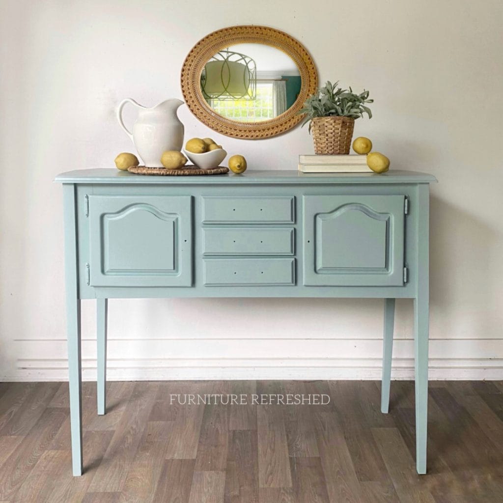 After photo of painted wooden sideboard with long legs. Painted in a duck egg blue color.