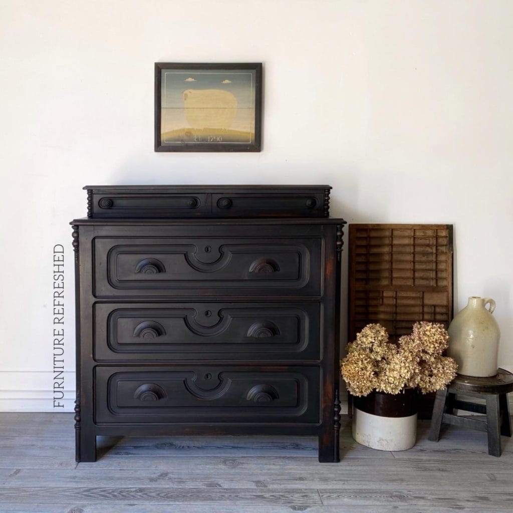 After photo of Eastlake chest of drawers painted black