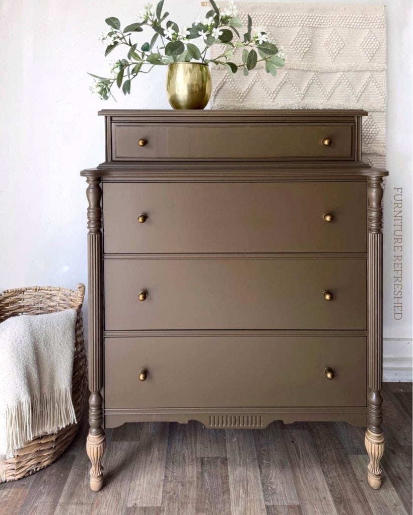 After photo of 4 drawer vintage dresser painted in a chocolate brown with raw wood front legs.