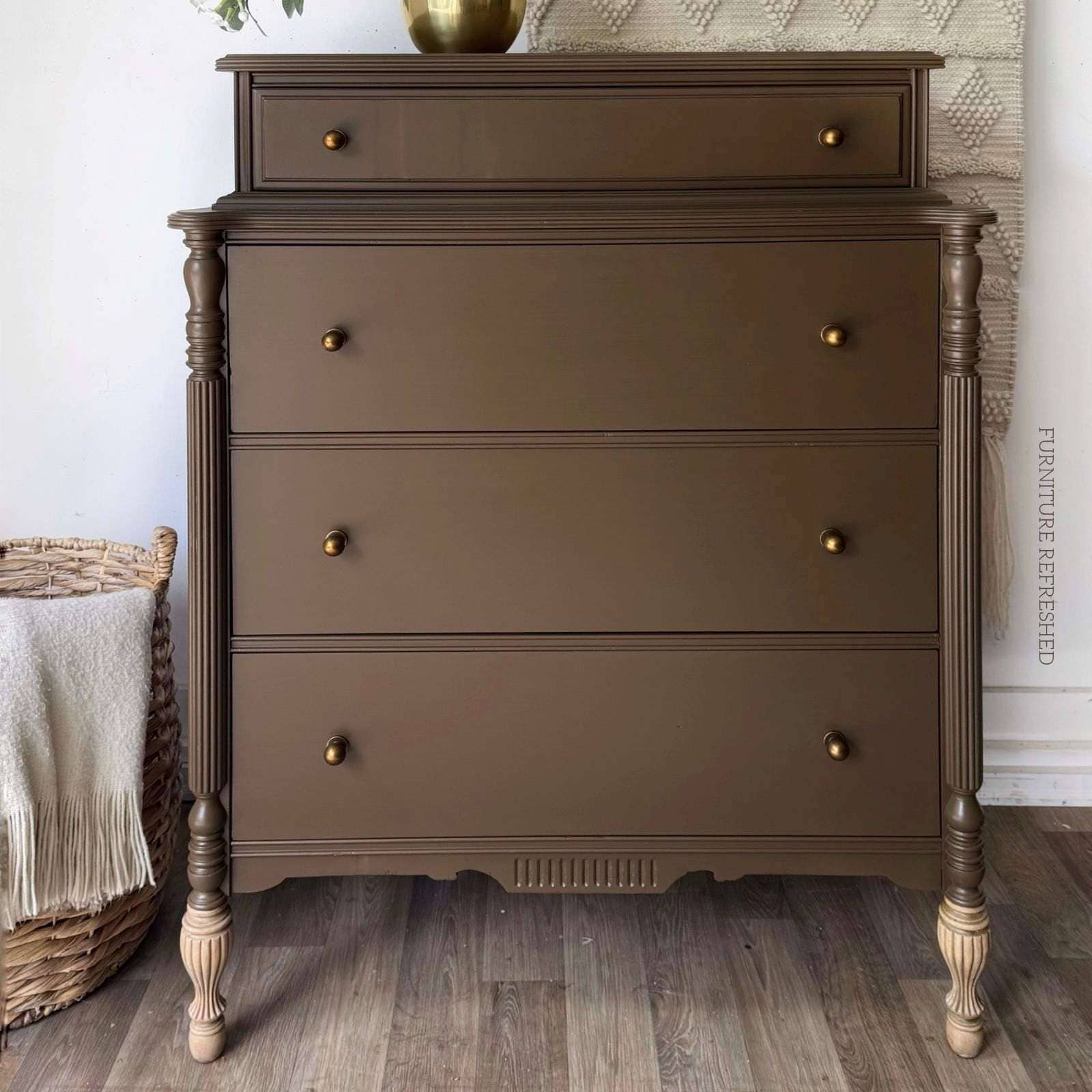 After photo of 4 drawer vintage dresser painted in a chocolate brown with raw wood front legs.