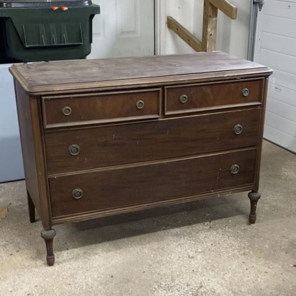Before photo of brown stained dresser.