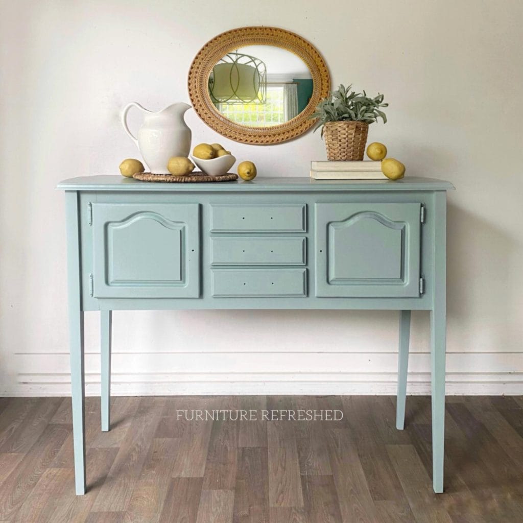 After photo of small sideboard painted in a duck egg blue.