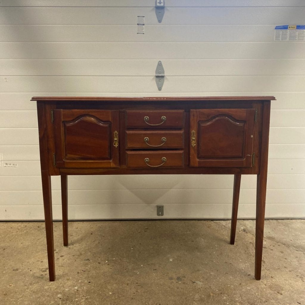 Before photo of small sideboard.