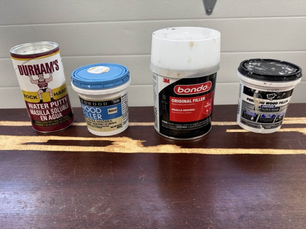 Four wood fillers I tested. Durham's Rock Hard Water Putty, Famowood wood filler, All-purpose Bondo, DAP Premium wood filler.