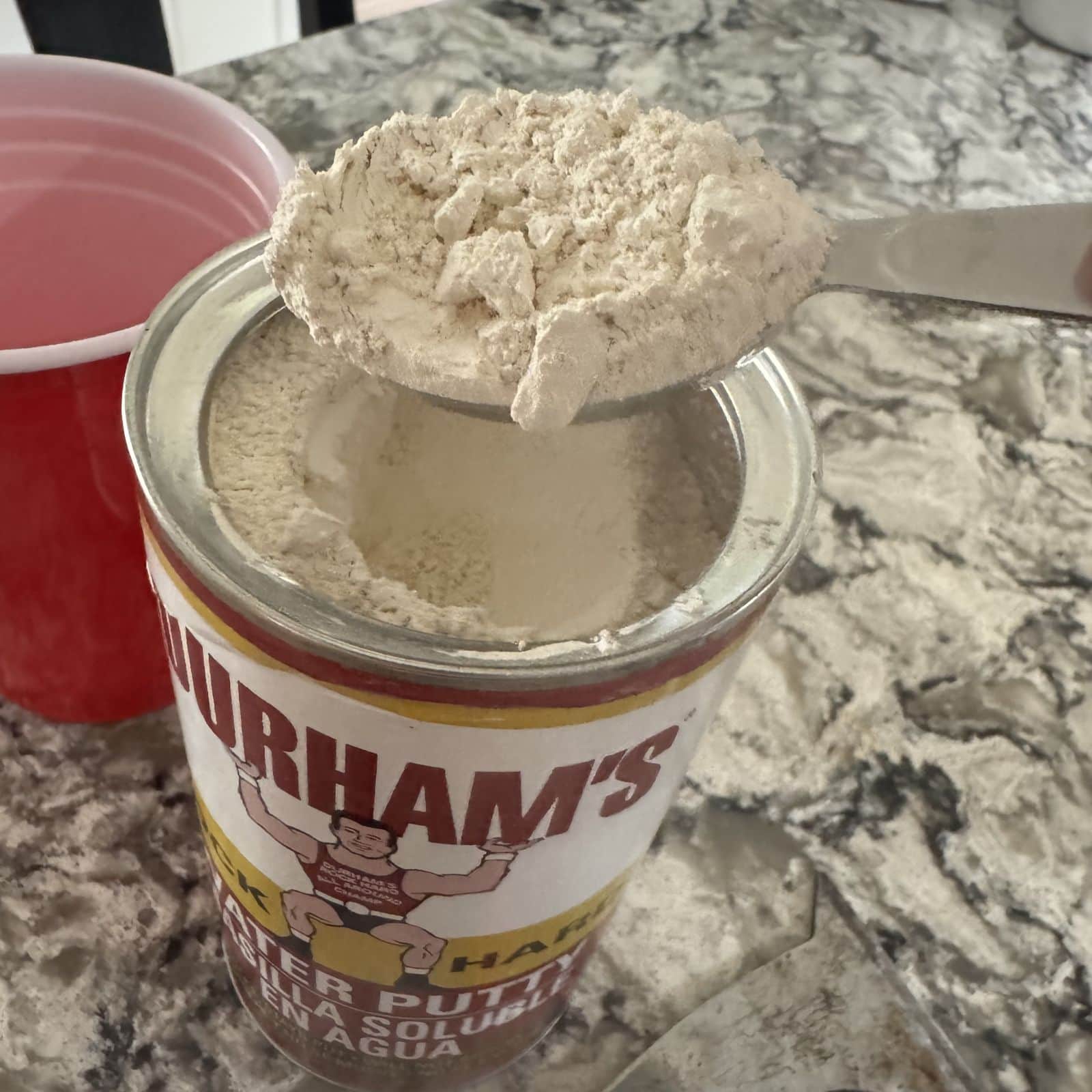 A close up of Durham's Rock Hard Water Putty powder.