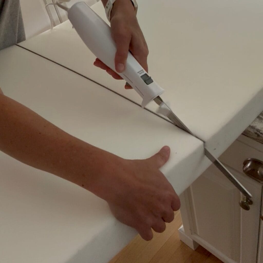 Cutting the high density foam with an electric carving knife.