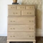 A vintage maple dresser that has been paint washed for a rash wood look.