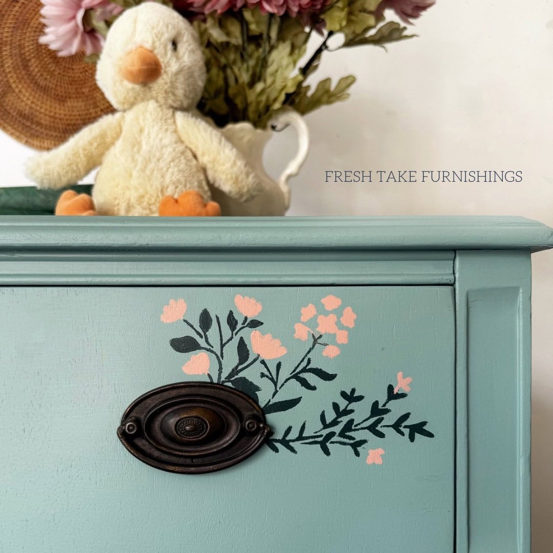 Close up of stenciling on a drawer front.