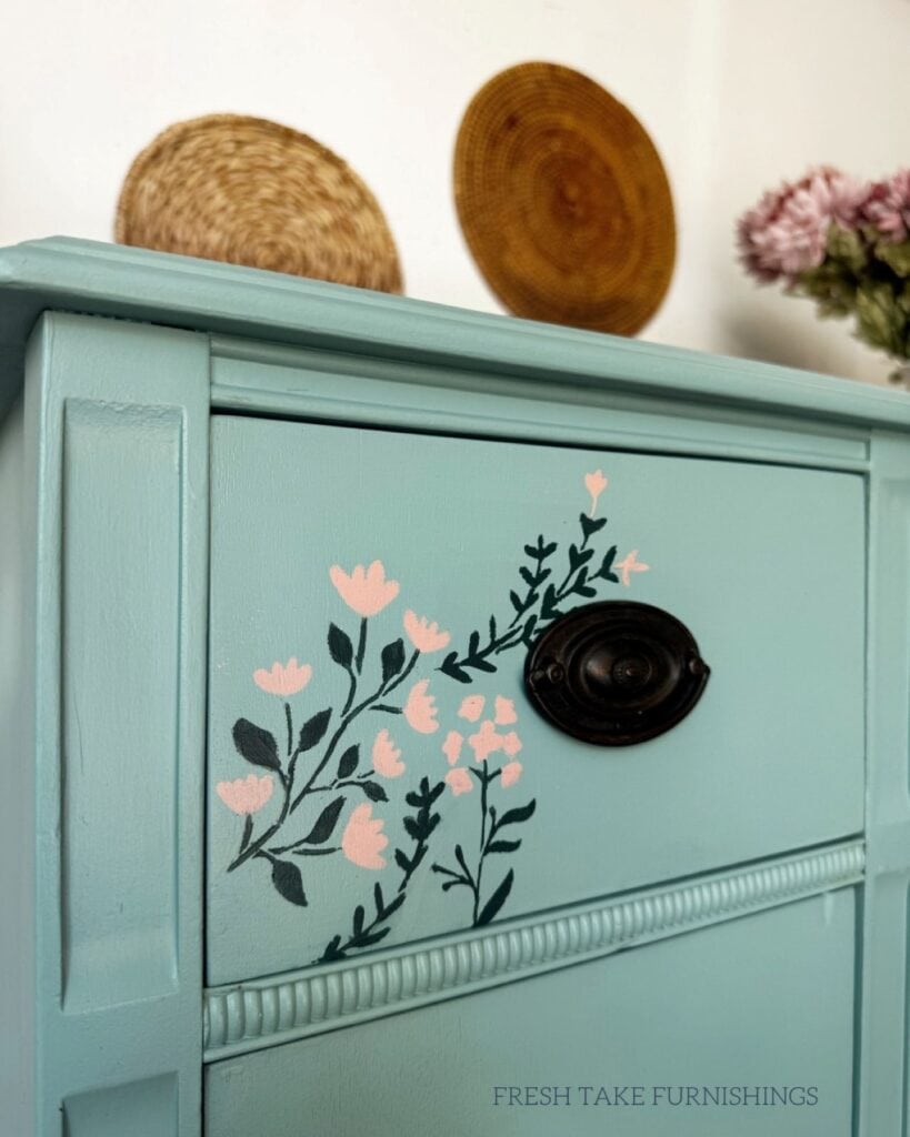 Sode angle close up of stenciling on a drawer front.