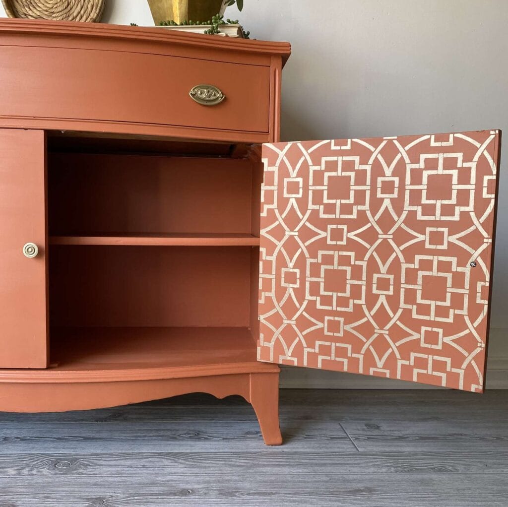 Close up of gold stenciled cabinet door.