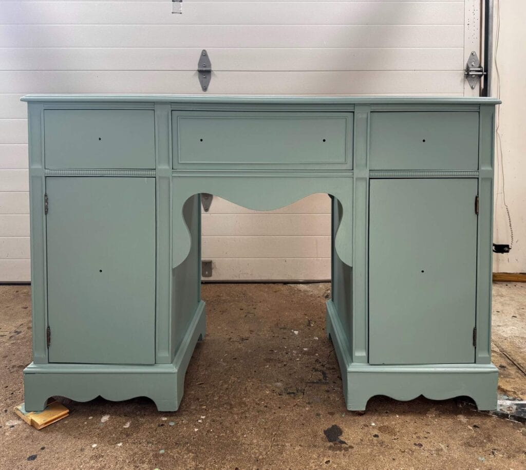 Vanity painted in a light green before stenciling.
