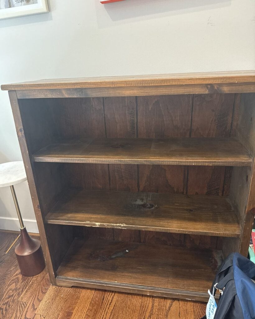Before photo of pine bookcase used in this makeover.