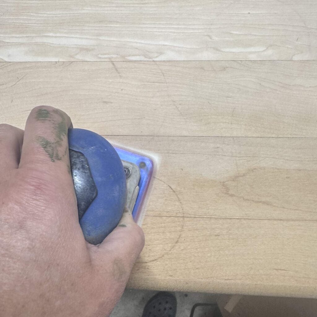 Sanding the butcher block top.