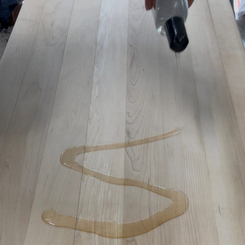 Apply Howard's foodsafe mineral oil to the butcher block top.