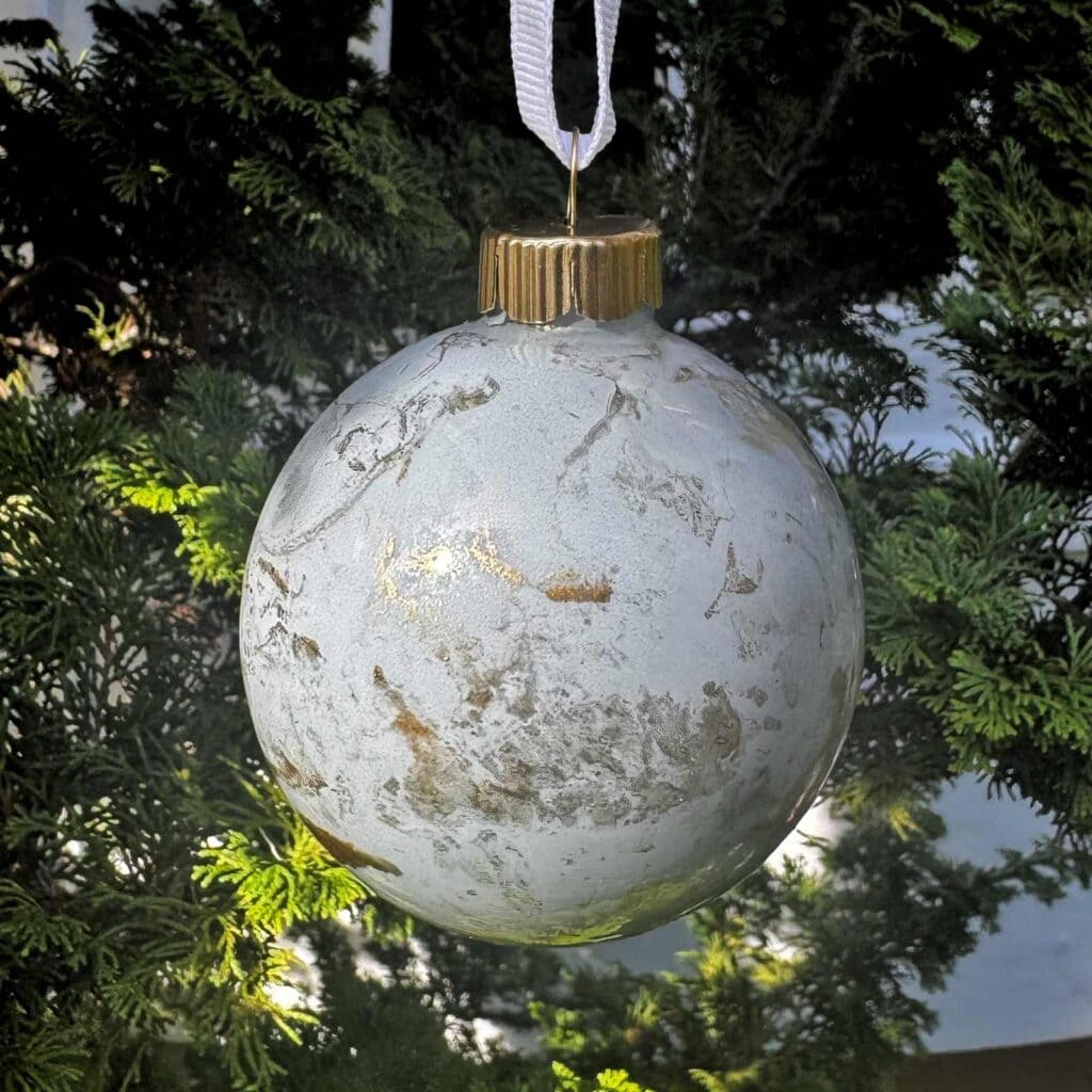 Close up photo of marbled Christmas ball ornament