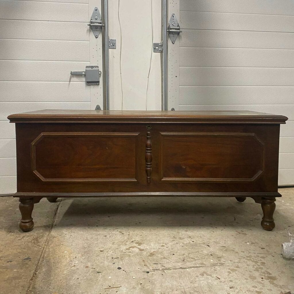 Dark wood cedar chest before makeover photo.
