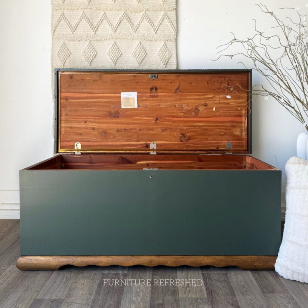 Cedar chest after photo painted green with a dark wood base.