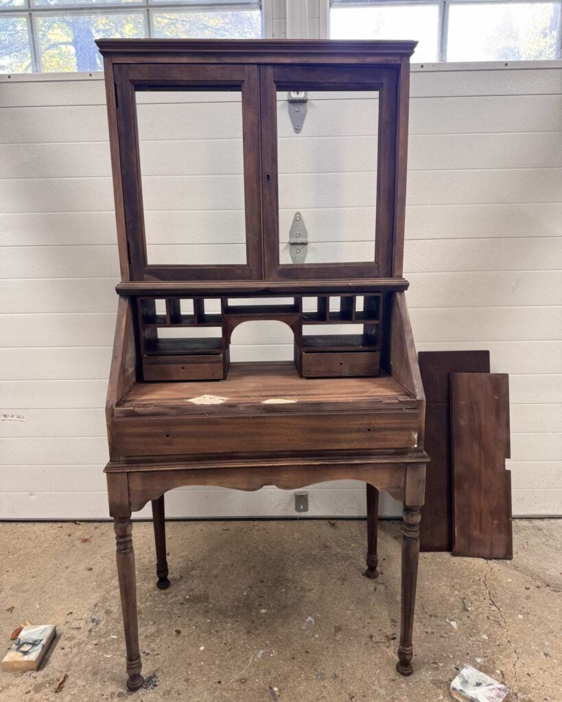 Before photo of secretary desk in a wood finish.