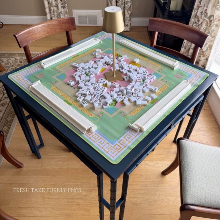 photo of finished Mahjong game table makeover with Majhong set up to play on it (with tiles, racks, a mat and a small lamp).