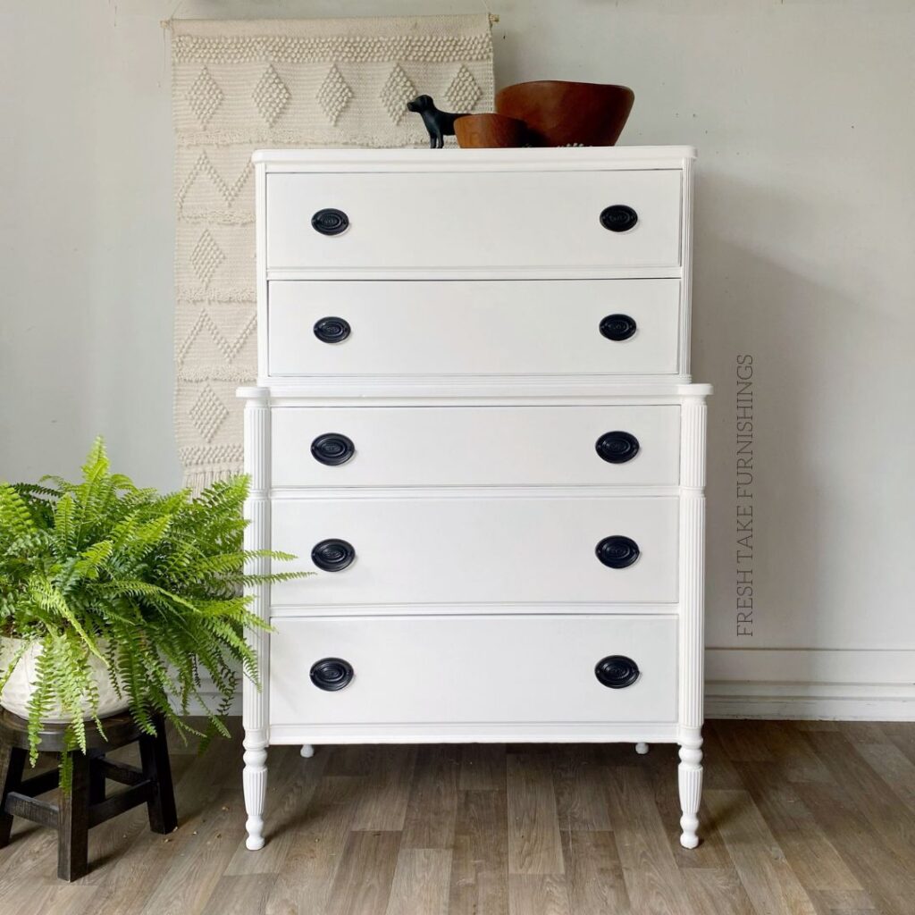 Before photo of Hepplewhite style tallboy dreeser painted pure white with black hardware.