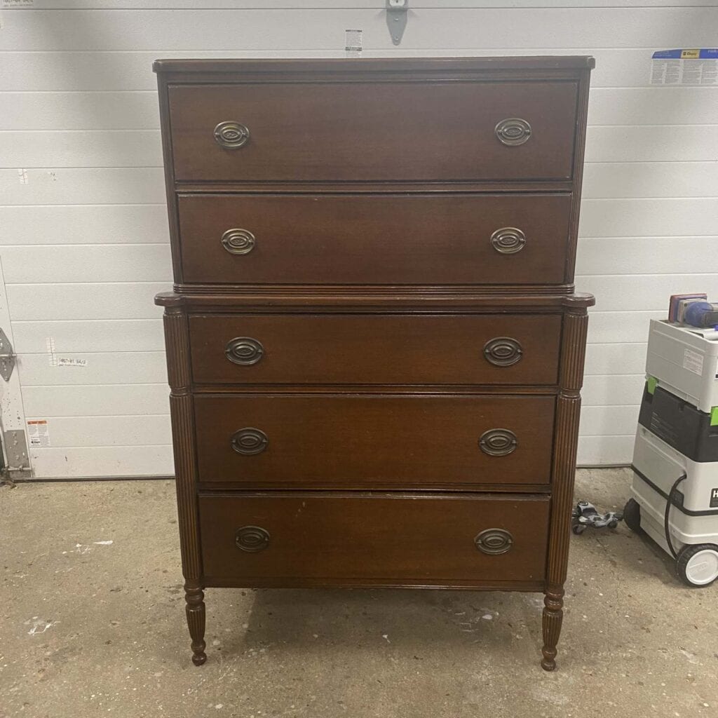 Before photo of Hepplewhite style tallboy dreeser.