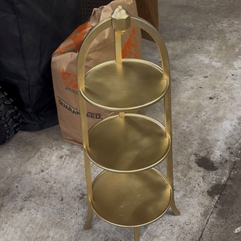 photo of the plant stand with the shiny metallic paint on it before any wax was added.